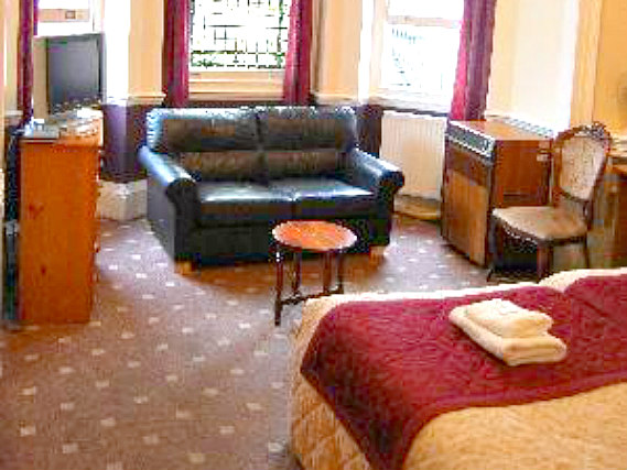 Put your feet up in front of the TV in your room at Gloucester Place Hotel