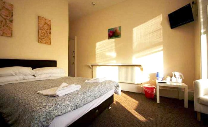 Get a good night's sleep in your comfortable room at Queenspark Budget Rooms