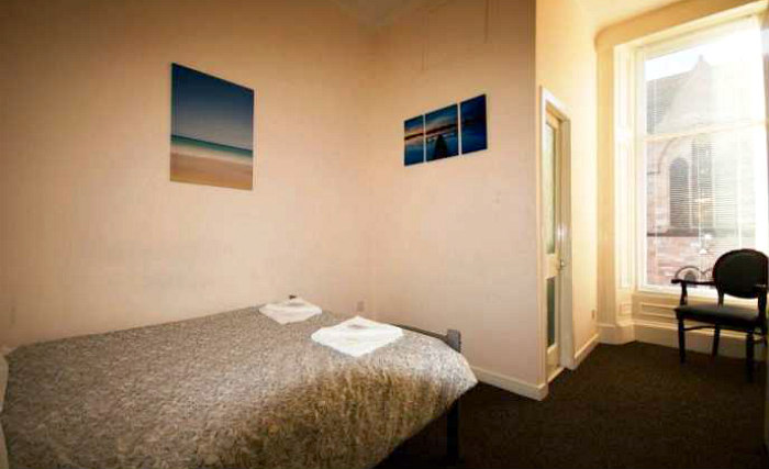 Rest easy in a comfortable bed in your room