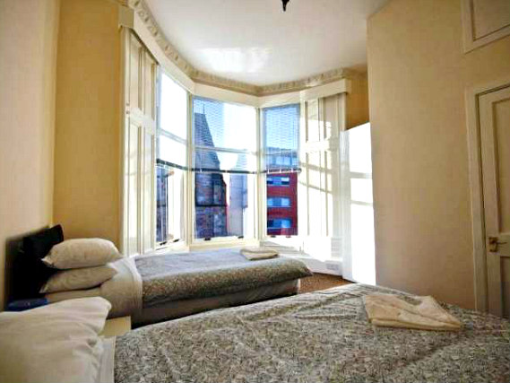 A twin room at Queenspark Budget Rooms is perfect for two guests