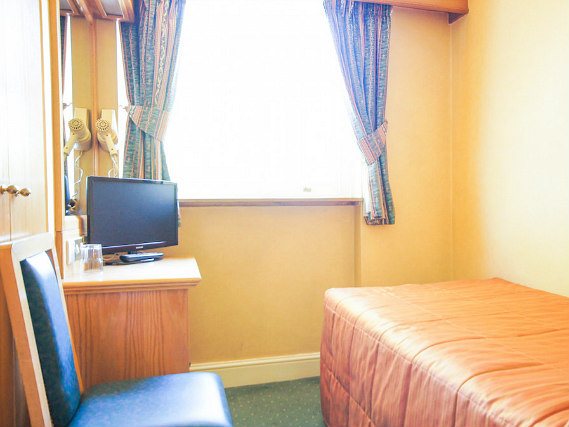 Put your feet up in front of the TV in your room