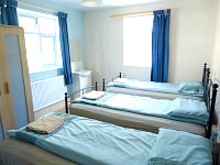 A typical triple room at Hour Glass Hotel