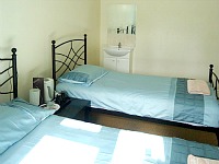 A typical twin room at Hour Glass Hotel