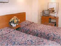 A twin room in Hyde Park West Hotel