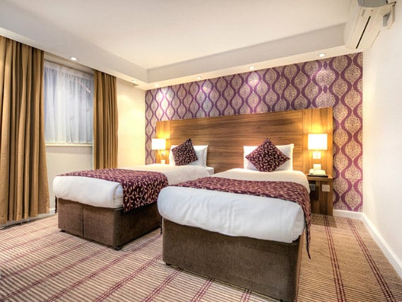 A twin room at City Continental London Kensington is perfect for two guests